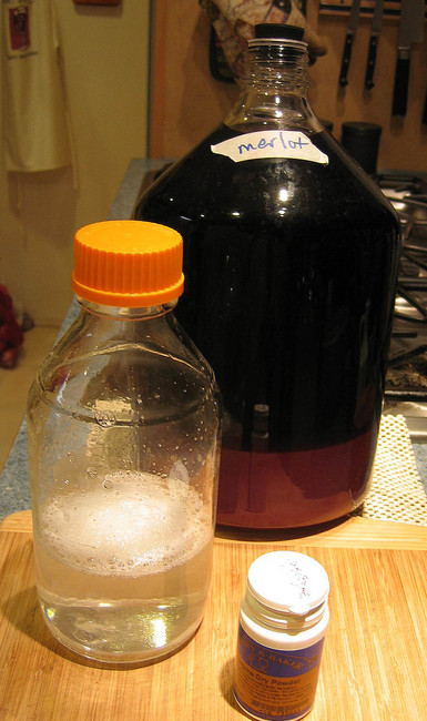 adding lysozyme to small jug merlot